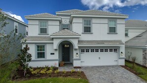 A two-story house with a garage, a front entrance with a door, and a small porch area.