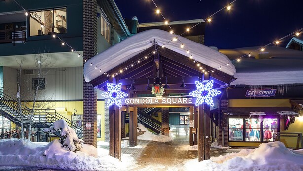 A snow-covered outdoor area with a wooden gazebo and a sign reading "GONDOLA SQUARE". - GSQ32 | Nice Views | Huge Private Deck | Steps from Steamboat Square (Steamboat Springs)