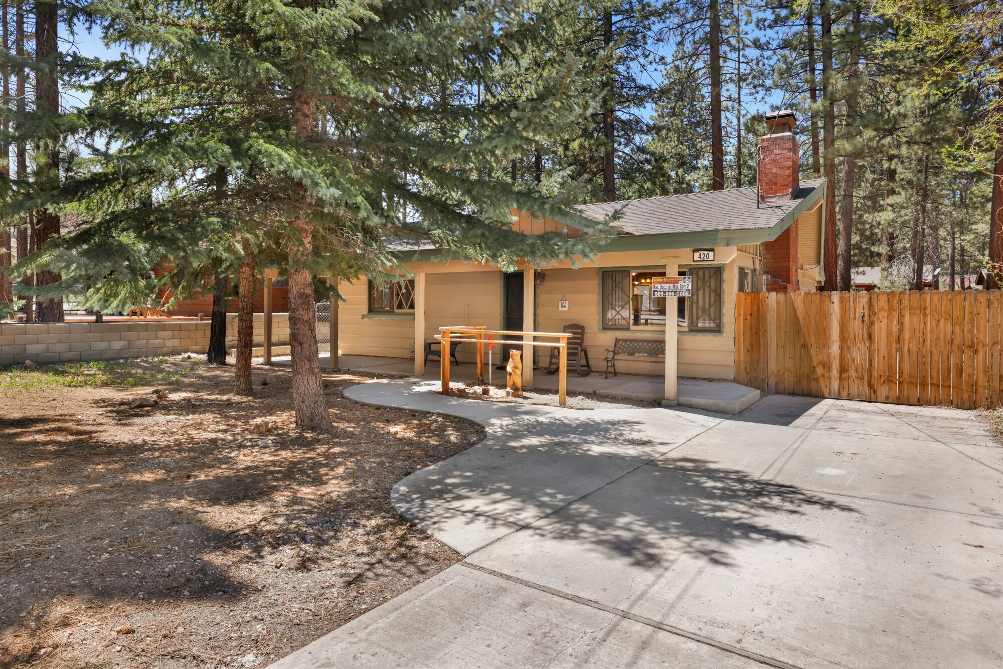 Convenient parking with welcoming front view of cabin, perfect for easy arrivals