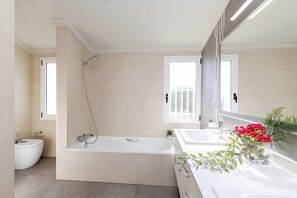 Bathtub, hair dryer, towels