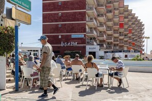 A building with multiple balconies and a restaurant named 'Luz de Mar' on the ground floor. - Fidalsa Relax Pool your Refuge (Torrevieja)