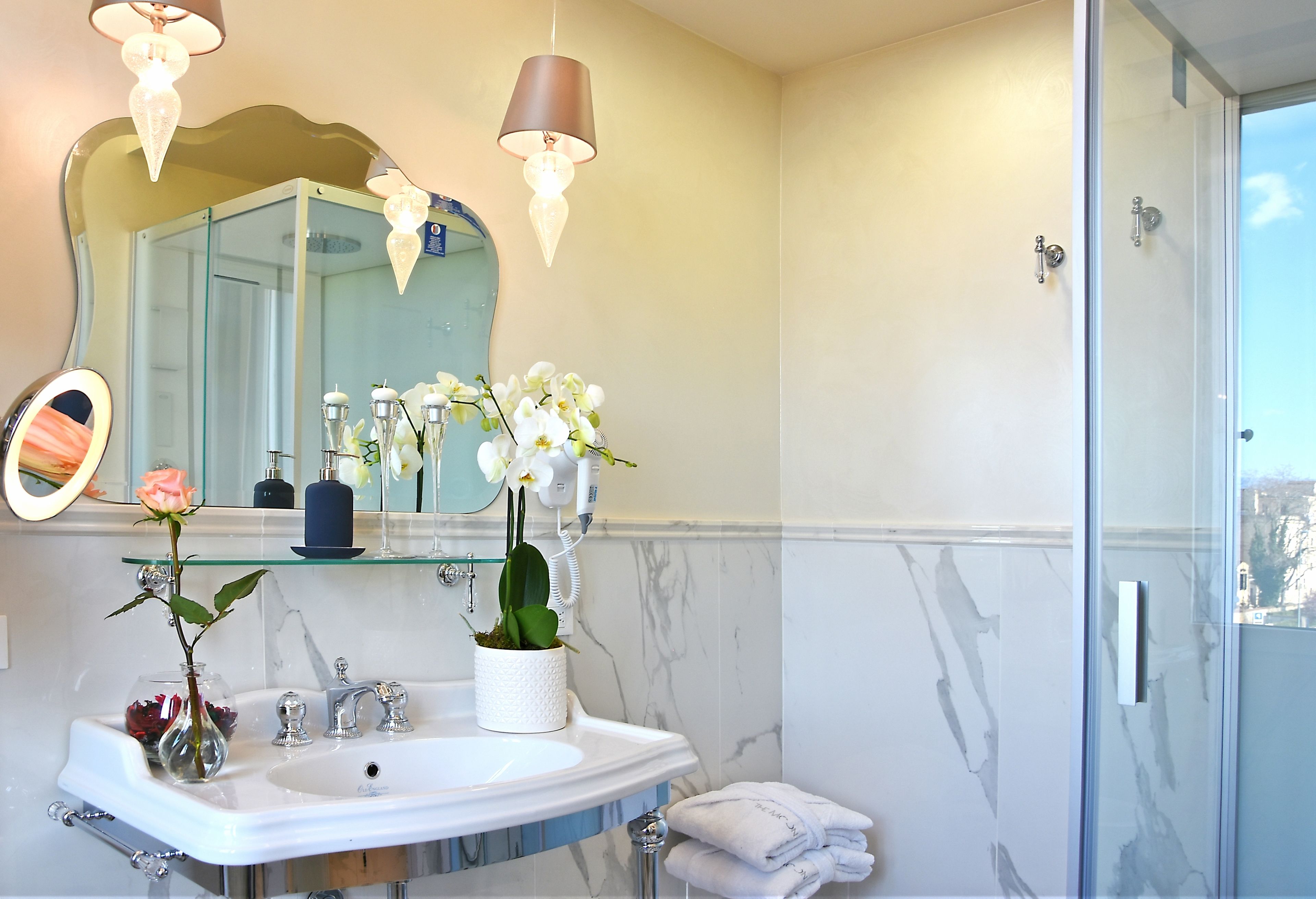 designer toiletries, hair dryer, bathrobes, slippers