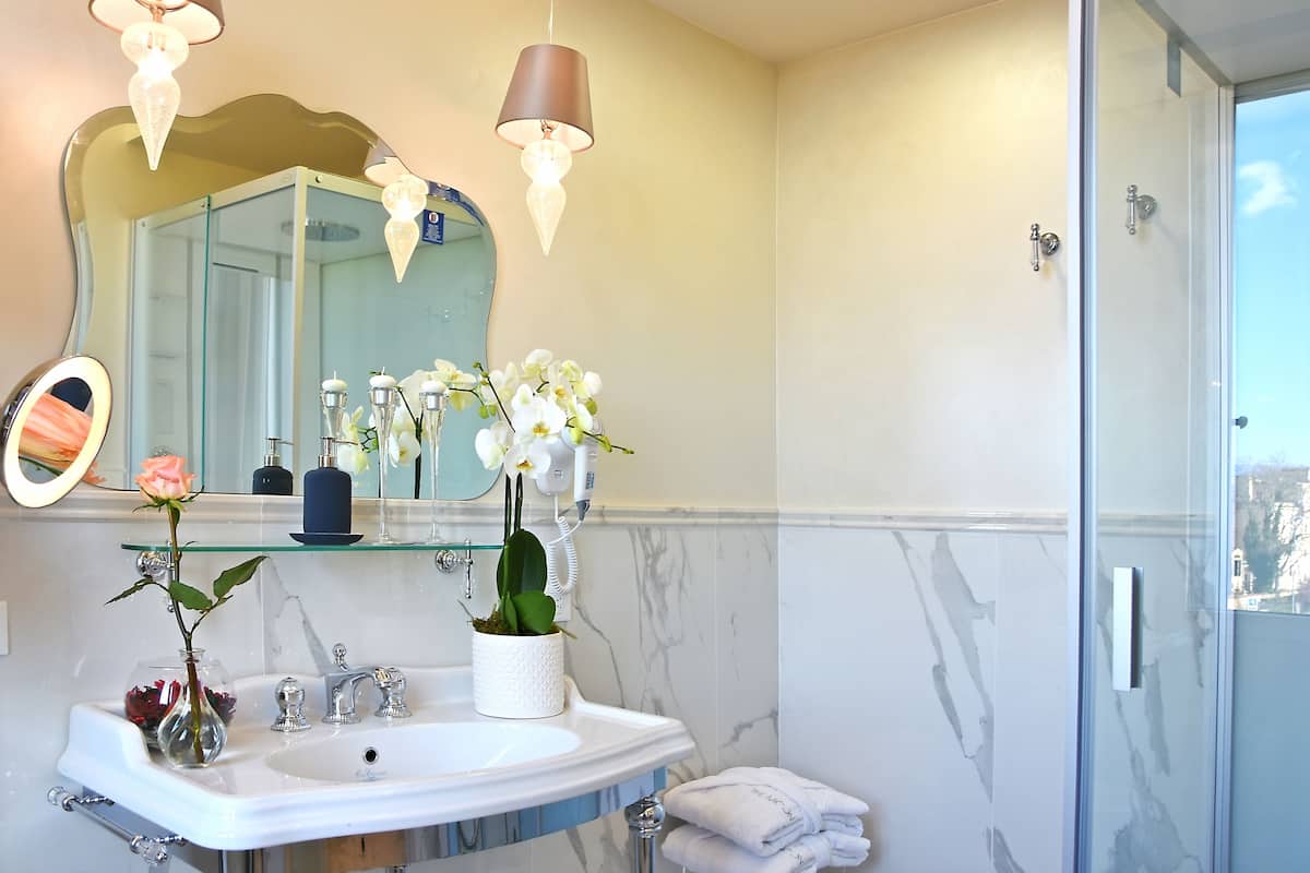 designer toiletries, hair dryer, bathrobes, slippers