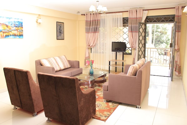 Suite, 3 Bedrooms | Living room | LCD TV - Delta Suites (Kampala)