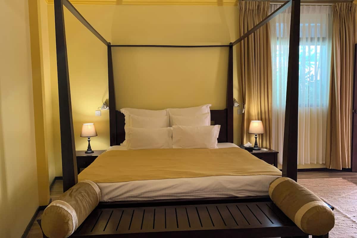 deluxe room (with free return airport transfer) | premium bedding, minibar, desk, laptop workspace