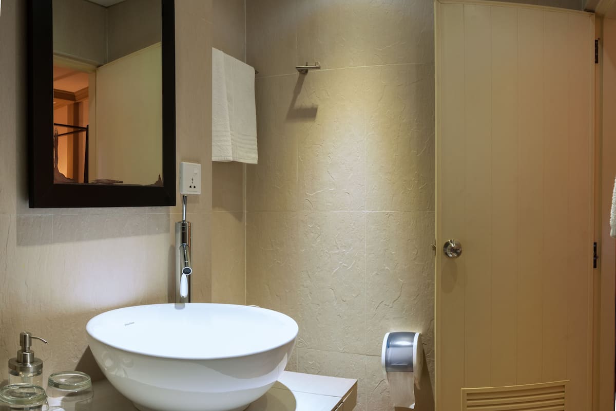 superior room (with free return airport transfer) | bathroom | shower, free toiletries, hair dryer, bathrobes