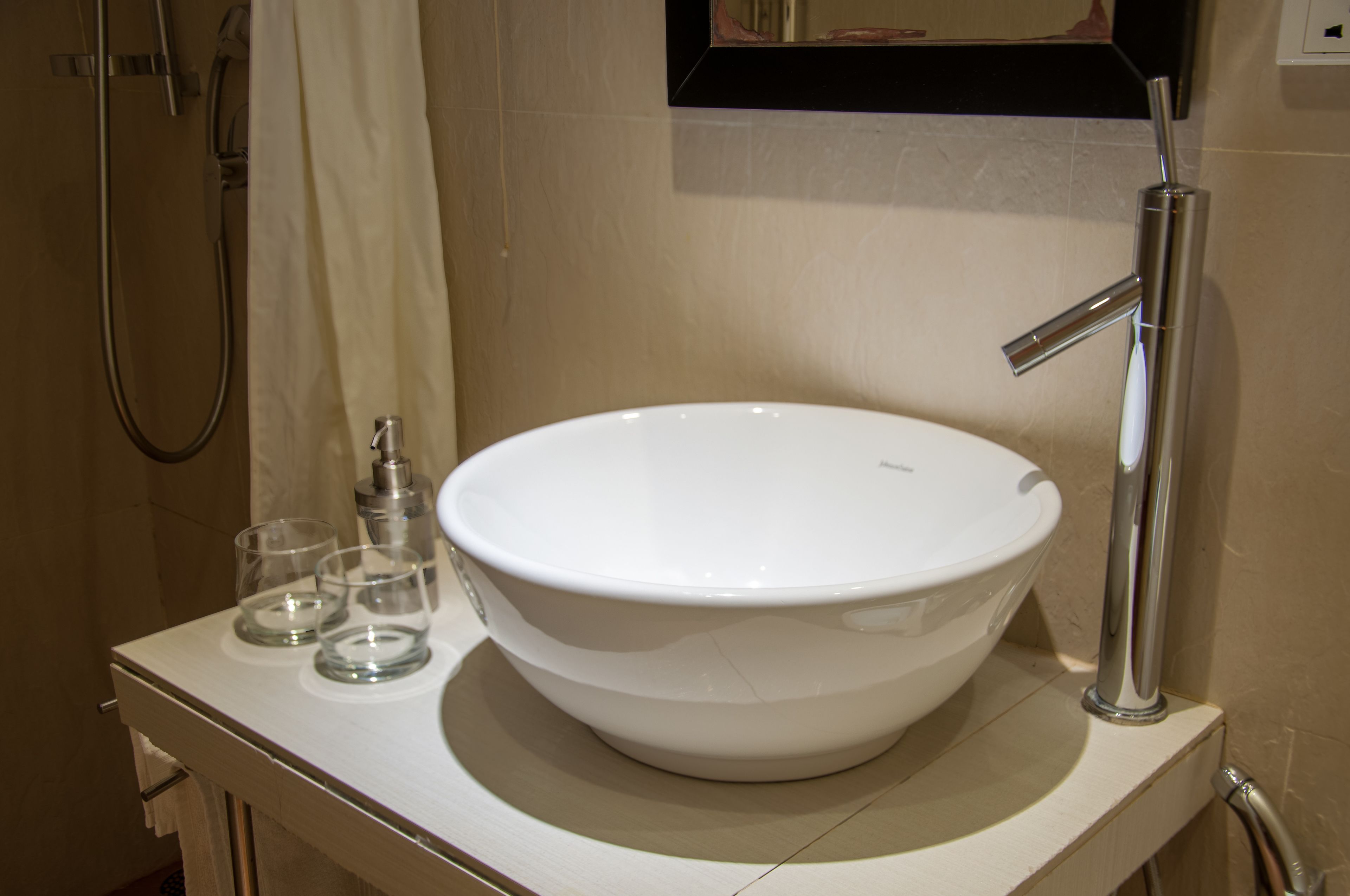 deluxe room (with free return airport transfer) | bathroom | shower, free toiletries, hair dryer, bathrobes