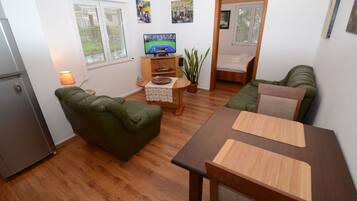 Apartment, Private Bathroom, Mountain View | Living area | Flat-screen TV