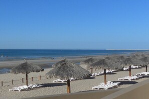 On the beach, sun loungers, beach towels