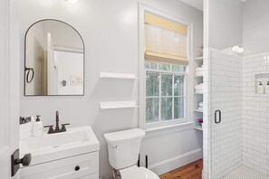 Shower, hair dryer, towels, shampoo