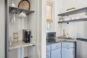 Fridge, microwave, stovetop, coffee/tea maker