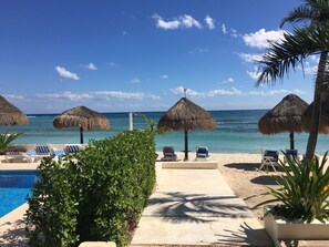 On the beach, sun-loungers, beach towels