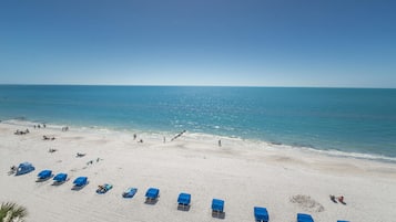 On the beach, sun loungers, beach towels