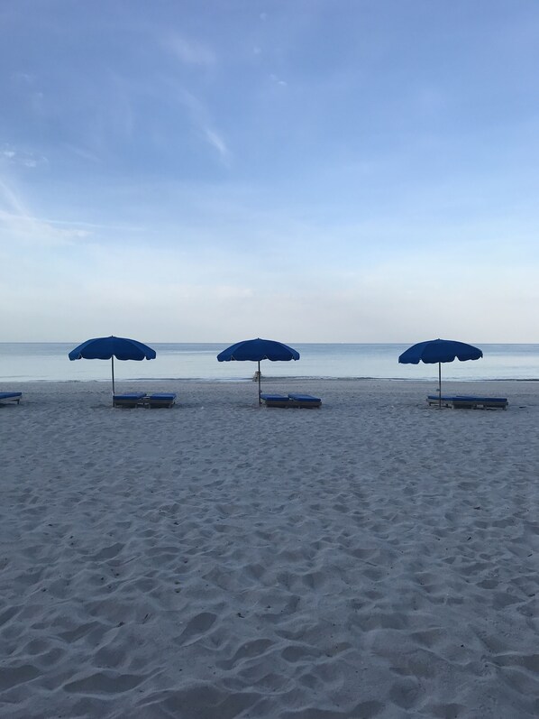 On the beach, sun loungers, beach towels