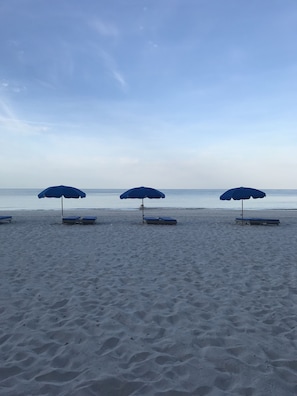 On the beach, sun-loungers, beach towels