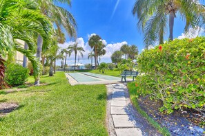 Enjoy a game of tennis or relax in the serene outdoor space.