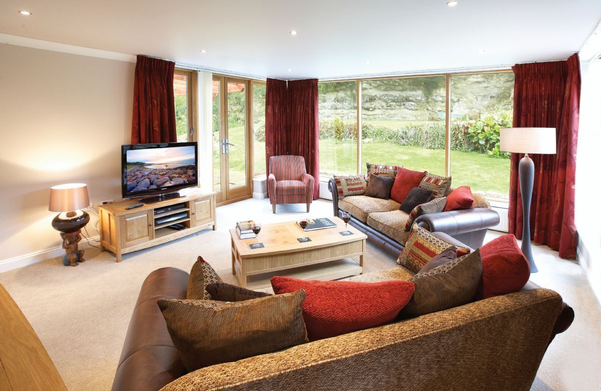 Ground floor:  Sitting room with TV and Sky HD, this room also leads on to the rear sun terrace