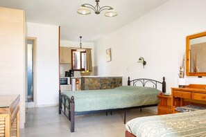 Cozy retreat with a single bed, dresser, and nightstand, perfect for a relaxing stay.