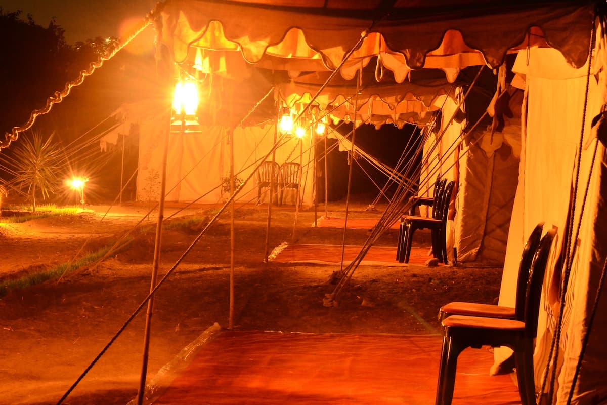 A tented area with chairs and a table, likely a dining or meeting space.