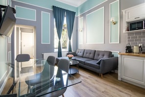 Exclusive Apartment, 2 Bedrooms, Balcony, Garden View | Living room | Flat-screen TV