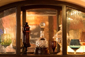 A display of glassware including a decanter, wine glasses, and a crystal decanter. - The Old Vine (Winchester)