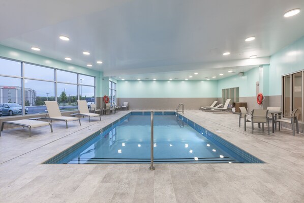 Indoor pool, open 7 AM to 11 PM, pool loungers
