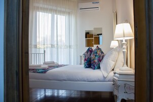 Family Room, Private Bathroom | Minibar, in-room safe, desk, iron/ironing board