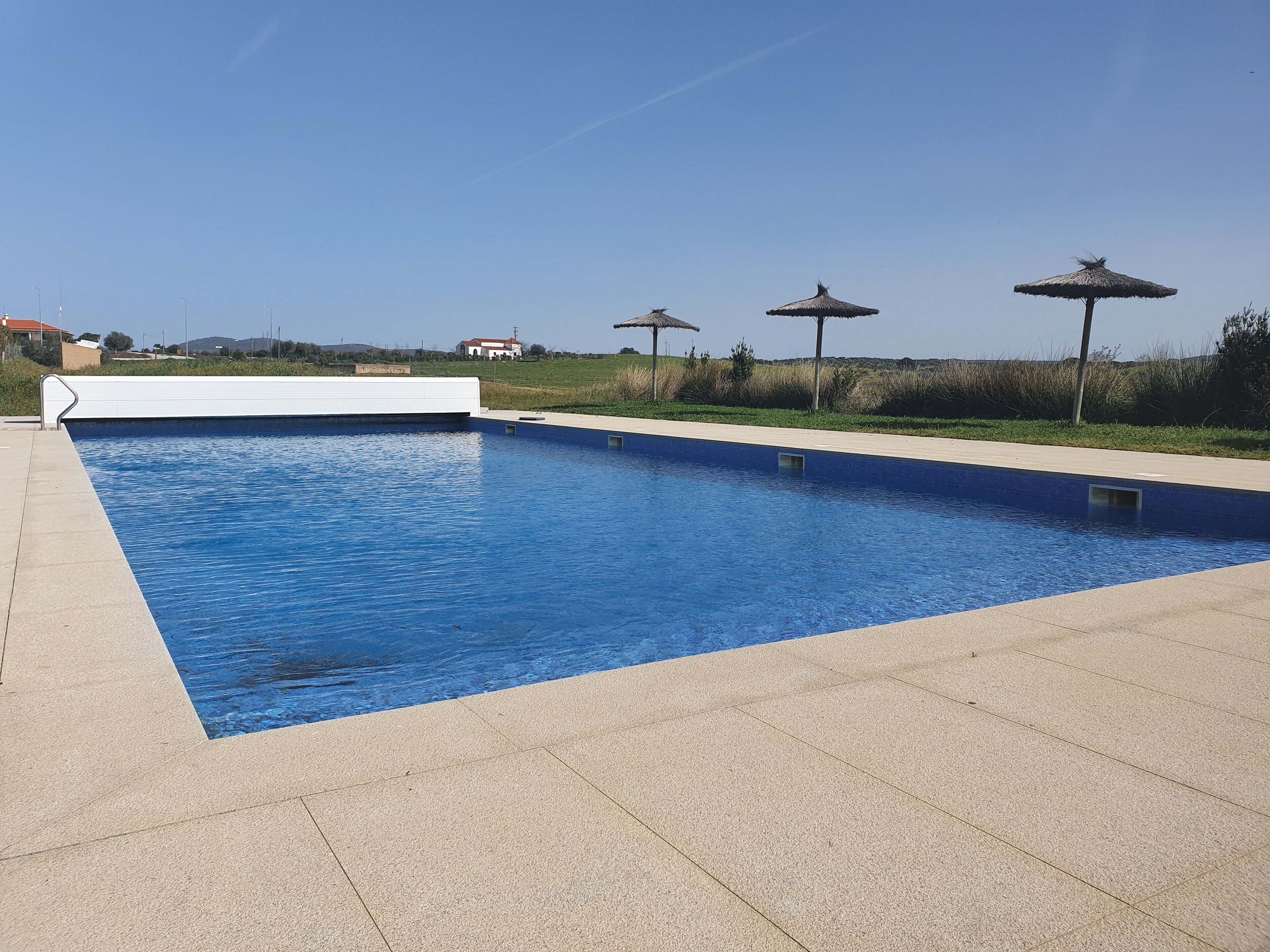 seasonal outdoor pool, pool umbrellas
