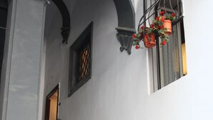 A staircase with stone steps and a handrail, leading to an entrance. - L' Arcata a Montesanto 1700s courtyard, metro & funicular (Napoli)