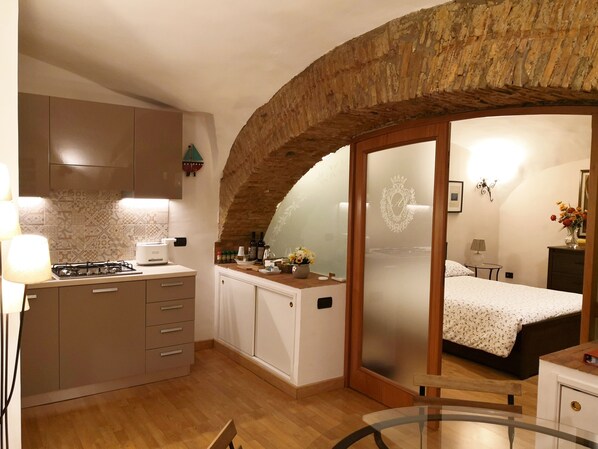 1 bedroom, desk, iron/ironing board, travel crib