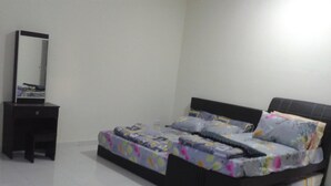 A bedroom with a bed, a nightstand, and a mirror. - HomeStay RoomStay Klebang Melaka (Malacca City)