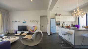 Apartment, 2 Bedrooms, Pool Access, Pool View | Living area | Flat-screen TV