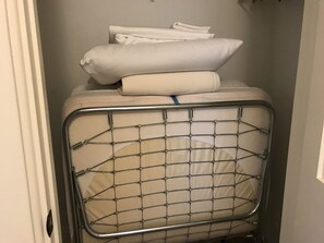 Guests can hang and dry clothes on the convenient mesh shelf.