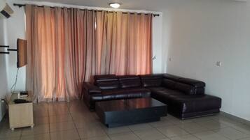Standard Apartment, 2 Bedrooms | Living room | Flat-screen TV