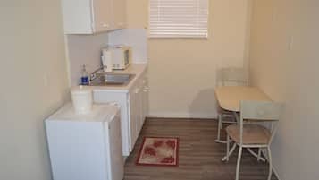 Fridge, microwave, cookware/dishes/utensils