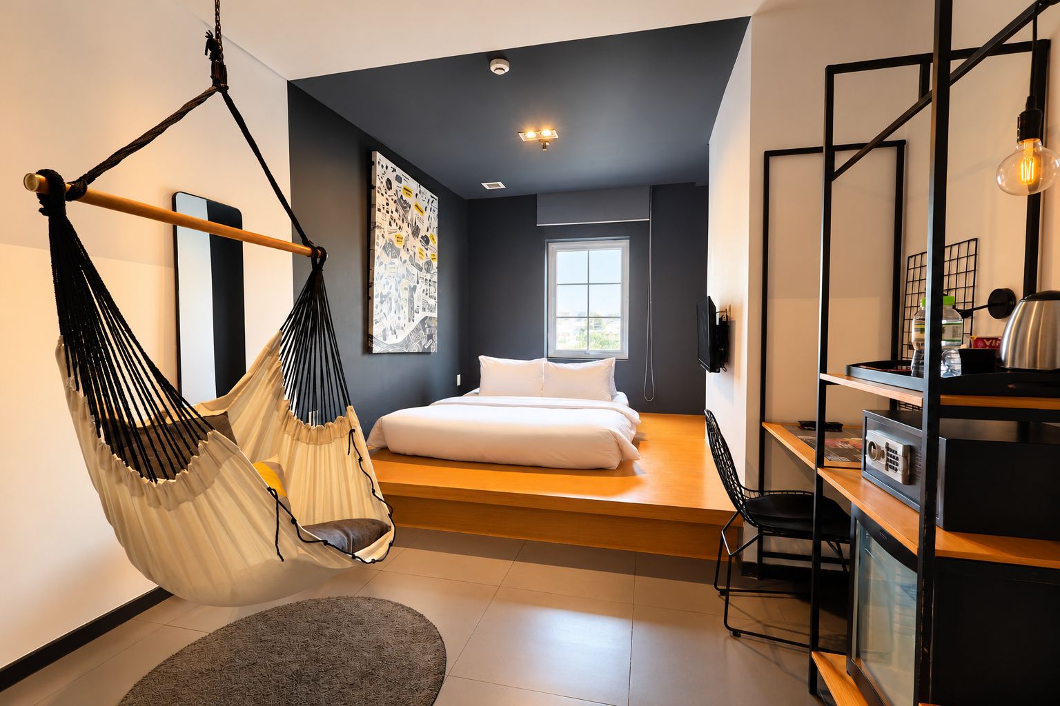 A modern bedroom with a hanging chair, a bed, a desk, and a large window.