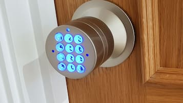 A modern door with a biometric fingerprint scanner.