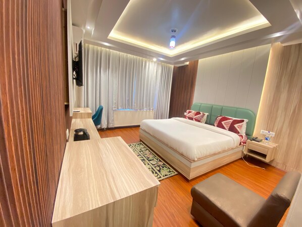 Habitación Deluxe | Minibar, camas extra, wifi gratis y ropa de cama