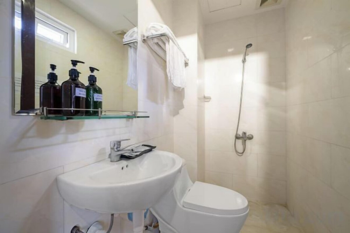 Shower, free toiletries, hair dryer, slippers