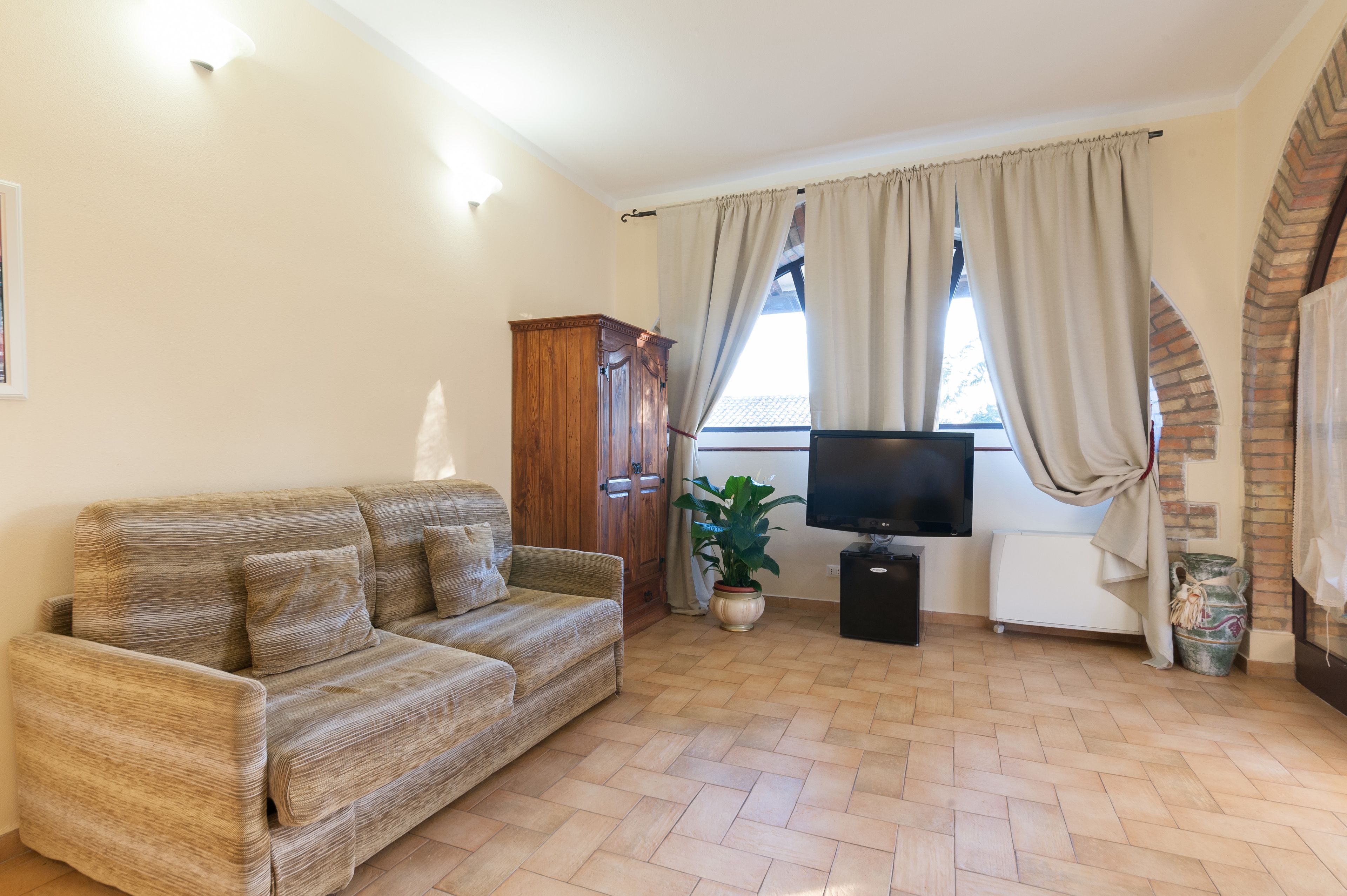 Chambre Quadruple Classique | Coin séjour