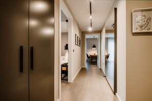 Premium Apartment, 2 Bedrooms (BUSINESS) | Living area | 43-inch flat-screen TV with cable channels, TV, books