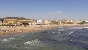 A beach with buildings in the background.