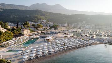 On the beach, sun-loungers, beach umbrellas, beach towels