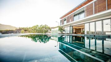 Grand Villa, 5 Bedrooms, Ocean View | Minibar, in-room safe, desk, soundproofing