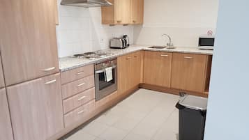 Premium Apartment, 2 Bedrooms, River View, Executive Level | Private kitchen | Coffee/tea maker, fridge, microwave, oven