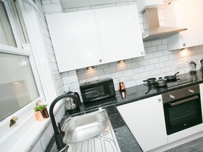 Apartment, Private Bathroom | Private kitchen | Fridge, microwave, stovetop, coffee/tea maker