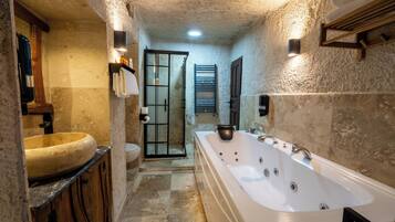 King Cave Suite | Bathroom | Hair dryer, slippers, bidet, towels