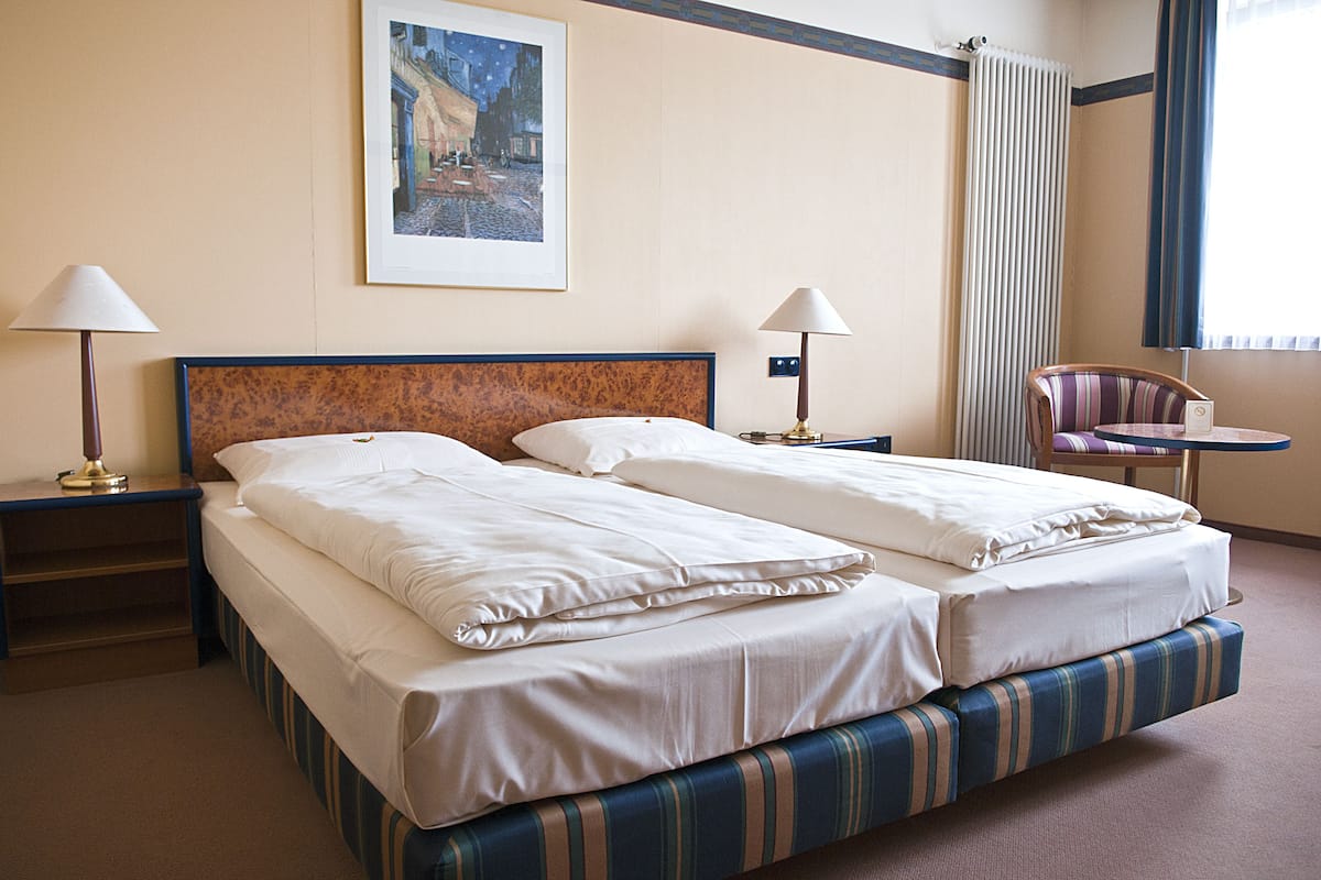 Comfort Double or Twin Room, City View | In-room safe, desk, soundproofing, rollaway beds