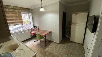 Apartment, 2 Bedrooms, Ground Floor | Private kitchen | Fridge, coffee/tea maker, electric kettle, cookware/dishes/utensils