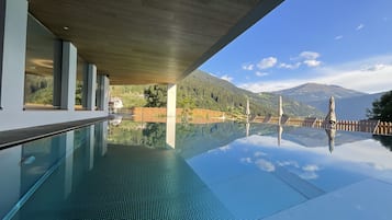 Outdoor pool, open 4:00 PM to 8:00 PM, pool umbrellas, pool loungers